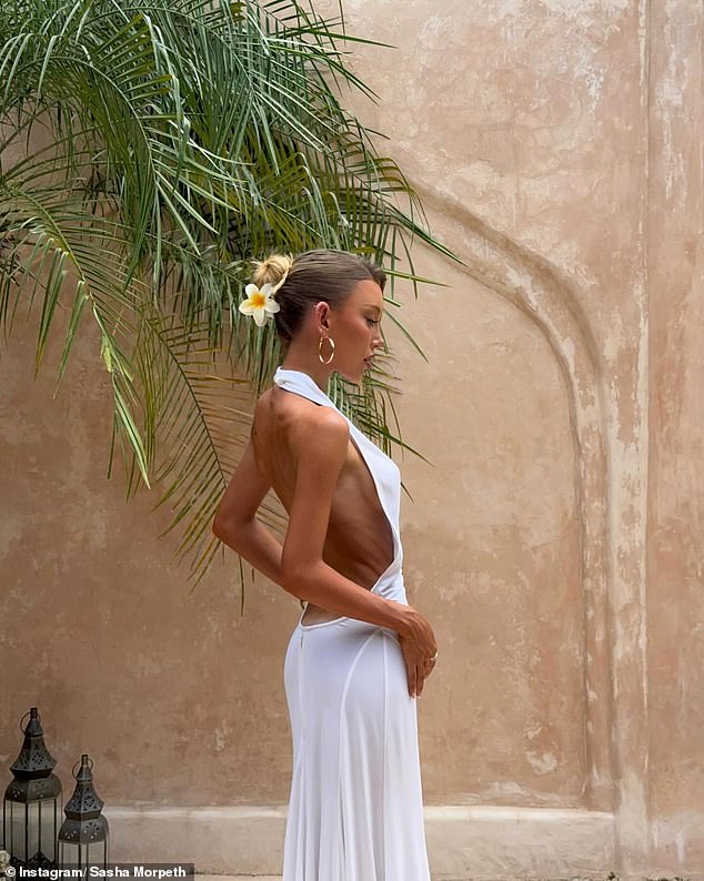 Sasha also showed off her figure in a revealing dress during a trip to Bali back in March