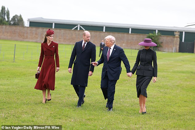 The First Lady and Princess of Wales negotiate the soggy grass at Windsor Castle