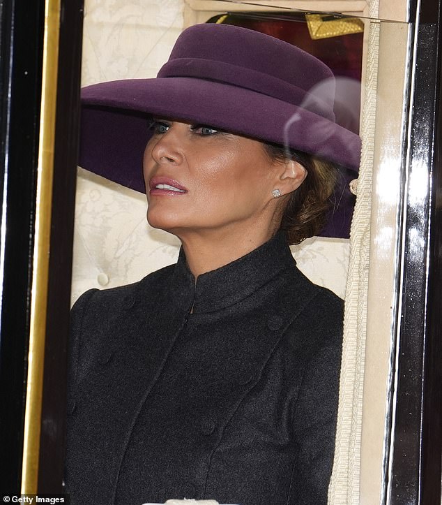 Earlier in the day, Melania wore a Christian Dior haute couture dark gray skirt suit