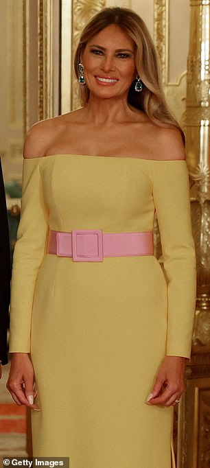 In others, the dress was more of a baby yellow shade, with a complimentary baby pink belt