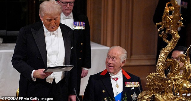 TOPSHOT - US President Donald Trump delivers a speech as Britain's King Charles III watches on during a State Banquet at Windsor Castle, in Windsor, on September 17, 2025, during the US President's second State Visit. US President Donald Trump arrived in Britain for an unprecedented second State Visit, with the UK government rolling out a royal red carpet welcome to win over the mercurial leader. (Photo by Yui Mok / POOL / AFP) (Photo by YUI MOK/POOL/AFP via Getty Images)