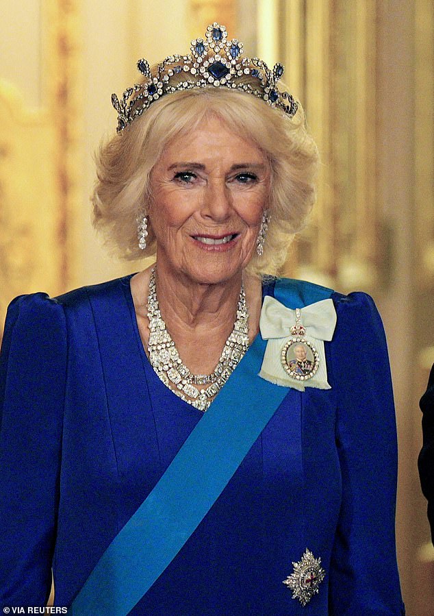 Camilla kept to her colour theme in a blue evening gown by Fiona Clare and a sapphire tiara that belonged to Queen Elizabeth II