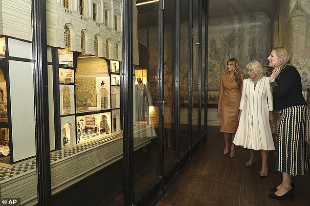 Queen Camilla and Melania Trump look at Queen Mary's Dolls' House at Windsor Castle today