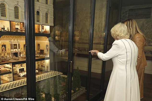 Camilla and Melania chatted with a staff member at the Royal Library at Windsor Castle on Thursday