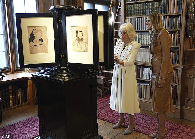 Melania Trump and Queen Camilla look at a collection at the Royal Library at Windsor Castle