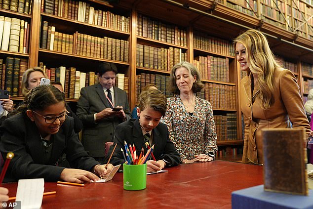 First Lady Melania Trump watches school children drawing in their miniature books today