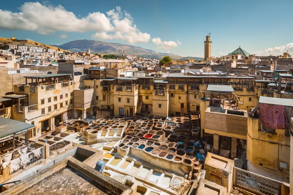 View of a traditional tannery in Fes, Morocco with numerous dyeing vats.
