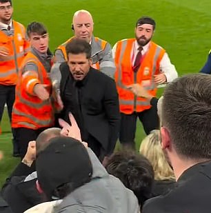 Simeone tried to confront the Liverpool fan sat in the Anfield Road Stand