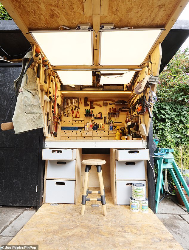 The shed boasts dual opening doors that provide 'rain protection' as a key feature alongside an overhanging green roof that stores garden tool
