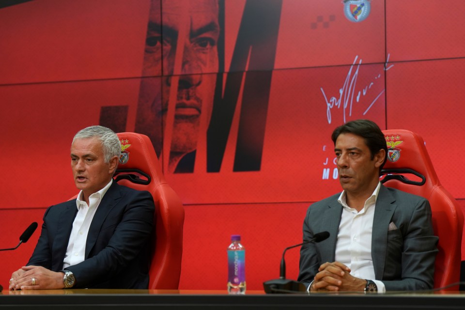 Benfica coach Jose Mourinho and president Rui Costa pose with a shirt.
