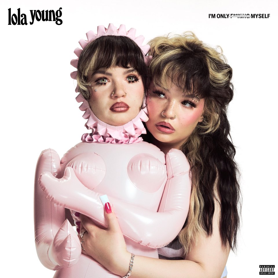 Lola Young album cover for 'I'm Only F**king Myself' featuring two depictions of the artist, one with a frilly pink bonnet and the other with messy dark and blonde hair, hugging a pink inflatable doll.