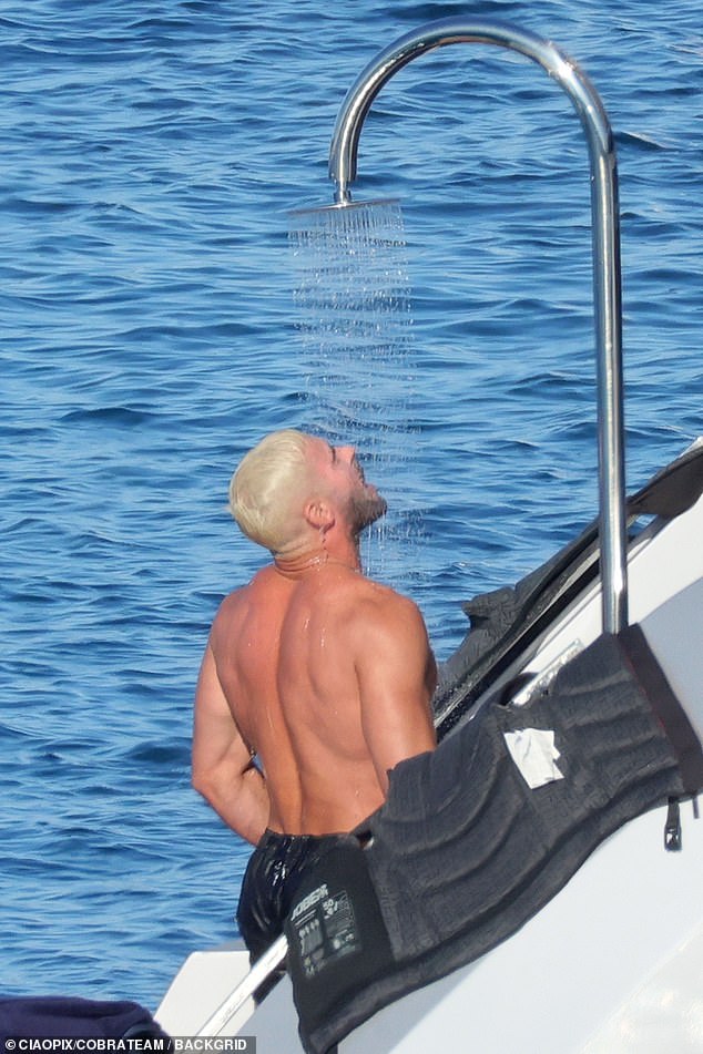 The former Disney Channel star, who was sporting bleach blonde hair,  took an outdoor shower while cruising aboard a lavish yacht