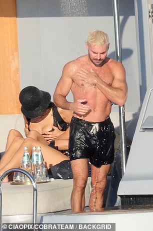 The former Disney Channel star, who was sporting bleach blonde hair, took an outdoor shower while cruising aboard a lavish yacht