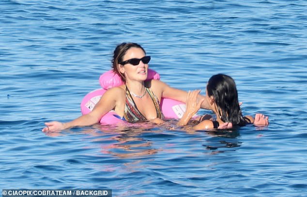 Also aboard were actor Miles Teller, 38, and his wife, Keleigh Sperry, 32, who seemed in high spirits as the group soaked up the Mediterranean sunshine, sipped cocktails and took turns plunging into the crystal-clear water