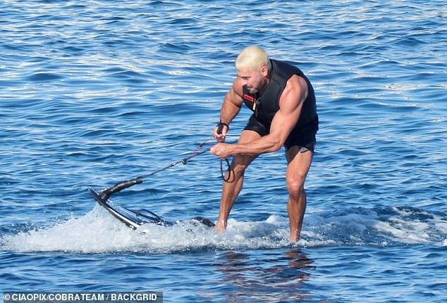 Efron splashed around on his water scooter