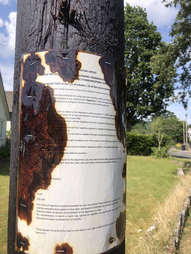 A sign, which has largely been damaged by liquid emanating from the pole. The paper had previously fallen off the mast