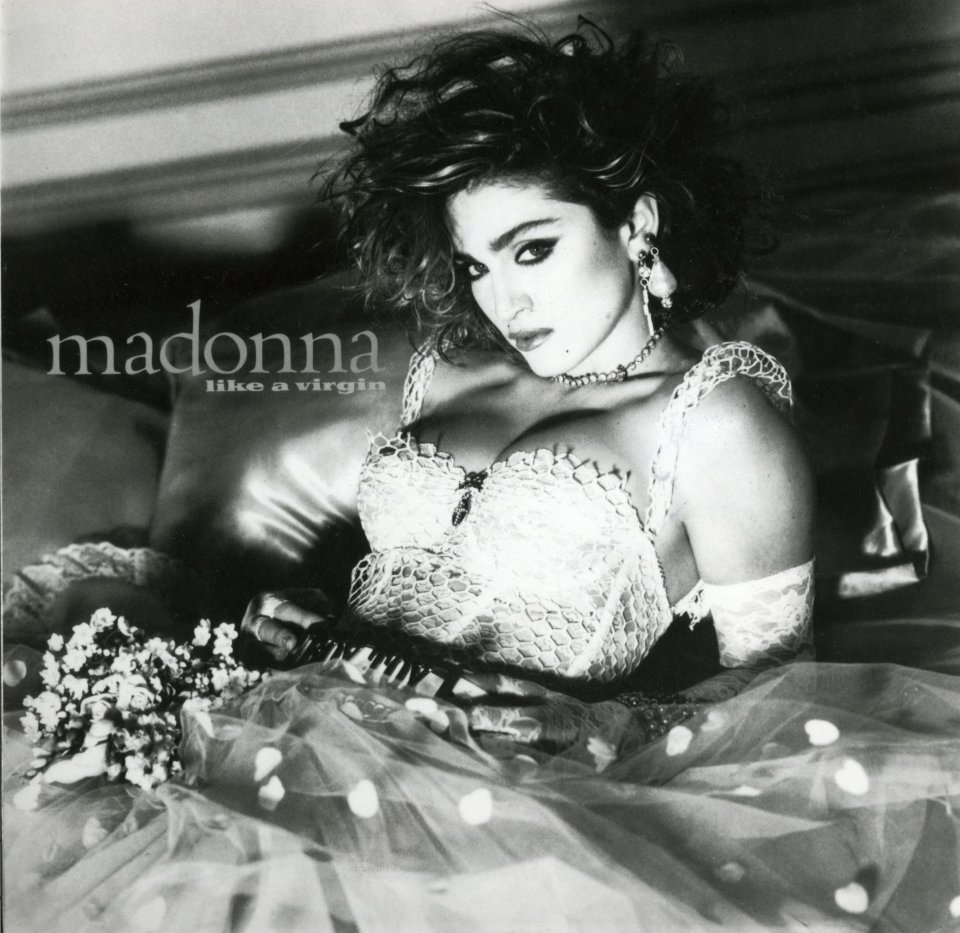 Madonna's album cover for "Like a Virgin," featuring her in a bustier and tutu.