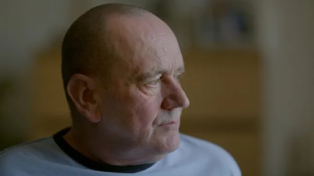 A 58-year-old man, Peter Macdonald, overcome with emotion.