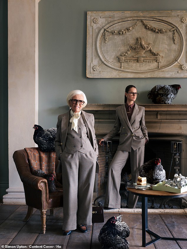 She accessorised her look with a brown trilby hat and cream neckerchief as she beamed with pair of stylish black glasses