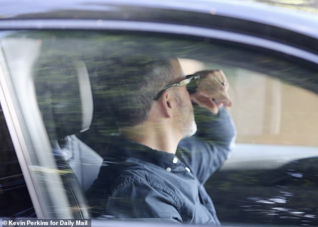 Pictures captured a tense moment as he put his head in his hands