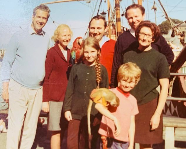 Helen, then nine, and brother David with mum Monica, second left, and dad Geoffrey, second right, and family friends