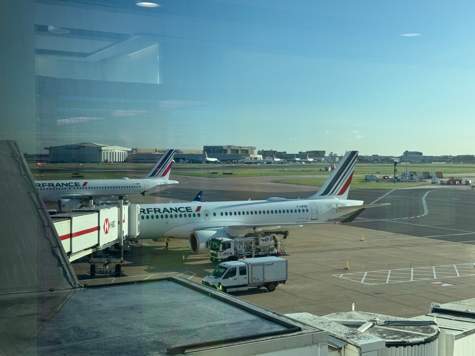 Air France plane at Heathrow Airport, seen from inside the terminal.