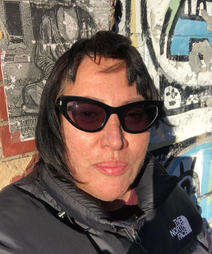 Diane Martel, music video director, wearing sunglasses and a black North Face jacket.