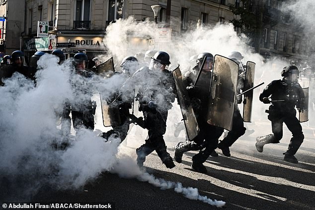 French riot police use tear gas on protesters during clashes at a demonstration in Paris as part of a day of nationwide strikes and protests against the government and cuts in the next budget, with supporters of the "Bloquons Tout" (Let's Block Everything) movement, France, September 18, 2025