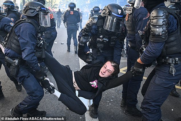 Clashes occur between French riot police and protesters during a demonstration as part of a nationwide strike in Paris on September 18, 2025
