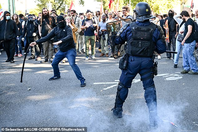 Demonstrators clashes with anti-riot police officers (CRS) during a demonstration called by unions trade against austerity, in Nantes, western France, on September 18, 2025