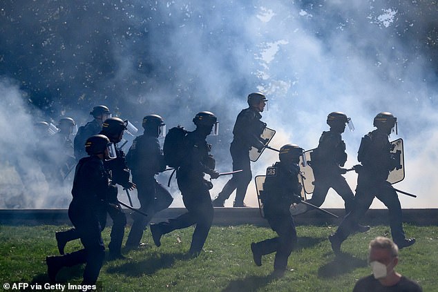 Anti-riot police officers charge during a demonstration in Nantes, western France, on September 18, 2025