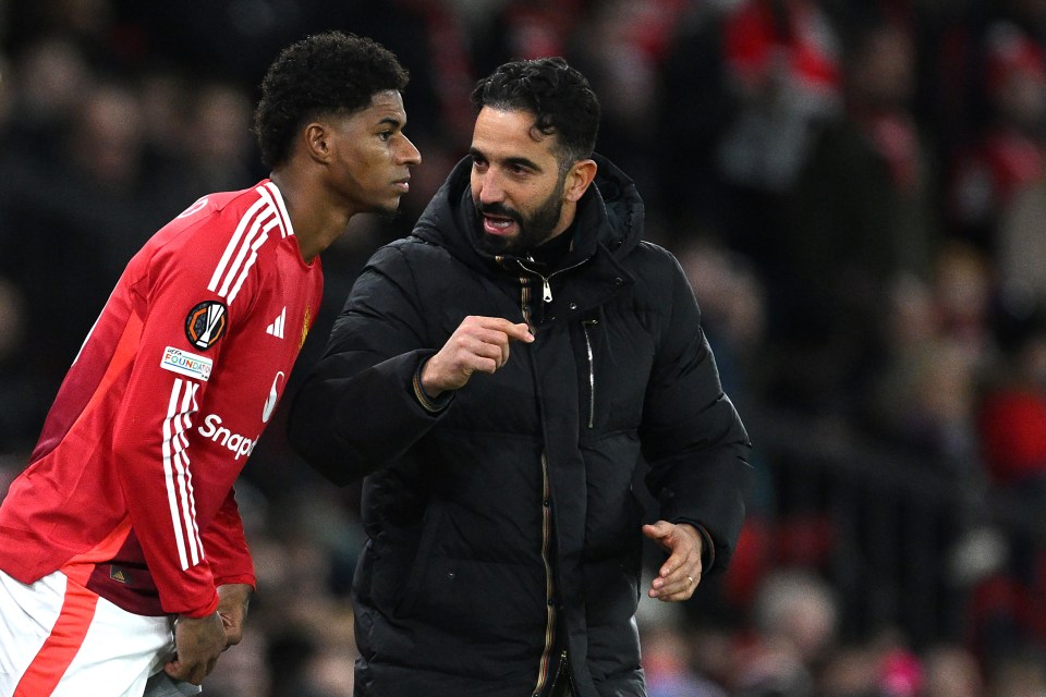 Manchester United Head Coach Ruben Amorim speaking to Marcus Rashford before he enters the field as a substitute.