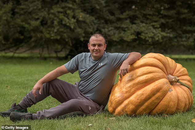 Beaming with pride, Michael posed beside his prize-winning veg, which took centre stage during the competition
