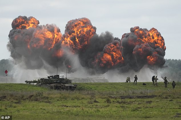 Smoke rises as Poland is staging its biggest military exercise of the year this week, bringing together more than 30,000 troops from the Polish armed forces and allied NATO nations in Orzysz, Poland, Wednesday, September 17, 2025