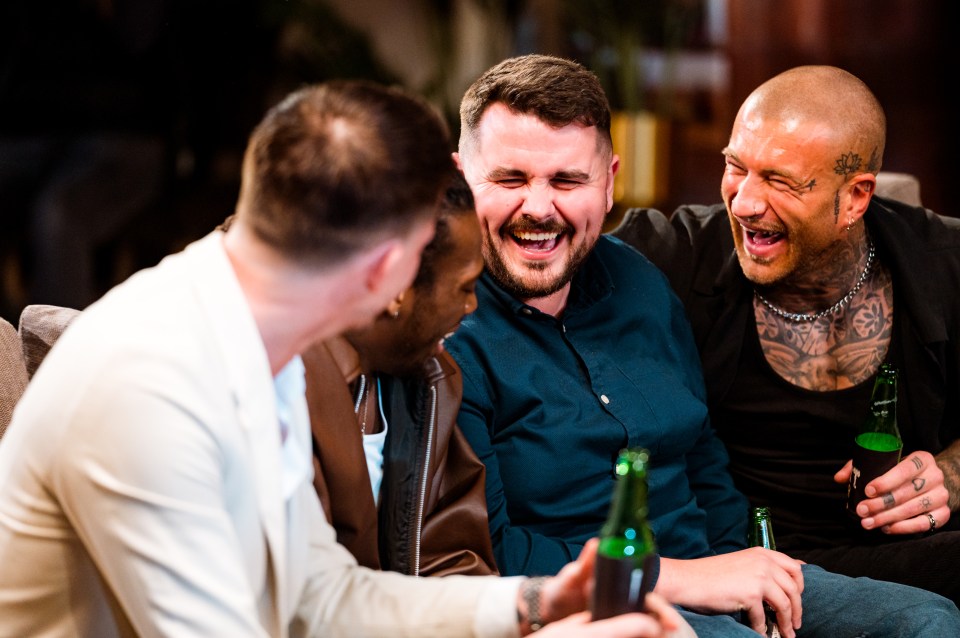 Dean and Joe laughing and drinking with friends.