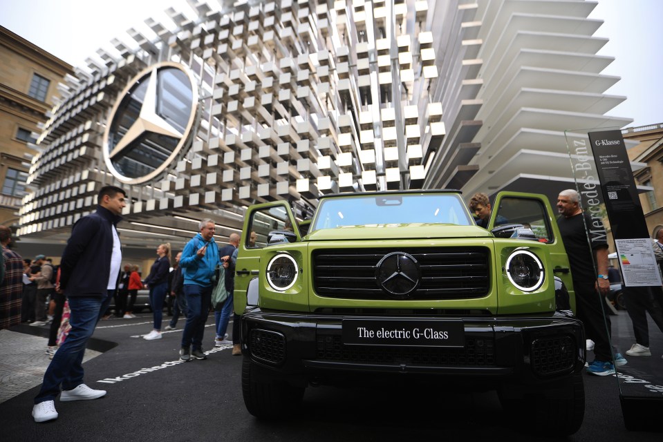 A lime green electric Mercedes-Benz G-Class is displayed at the IAA Mobility 2025 expo.