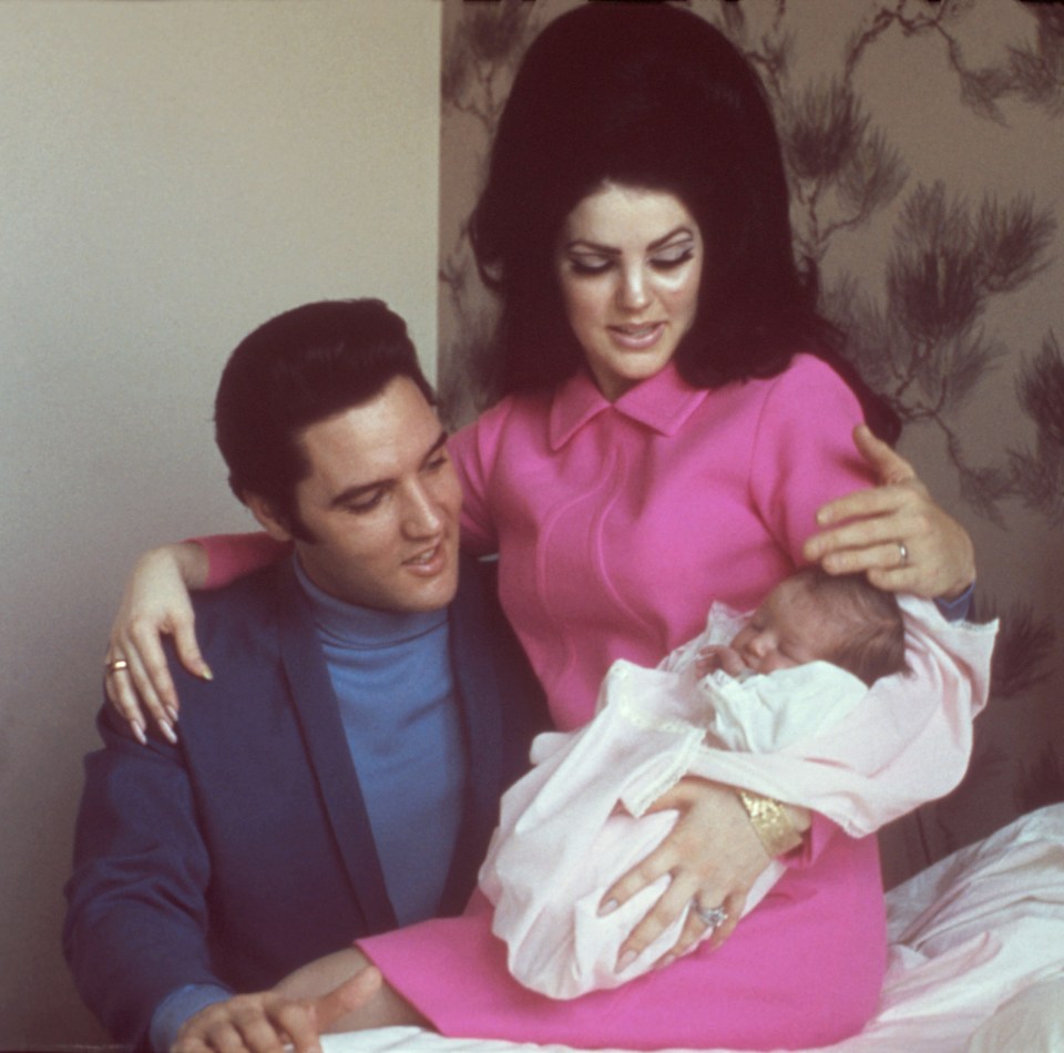 Elvis and Priscilla Presley with their infant daughter Lisa Marie.