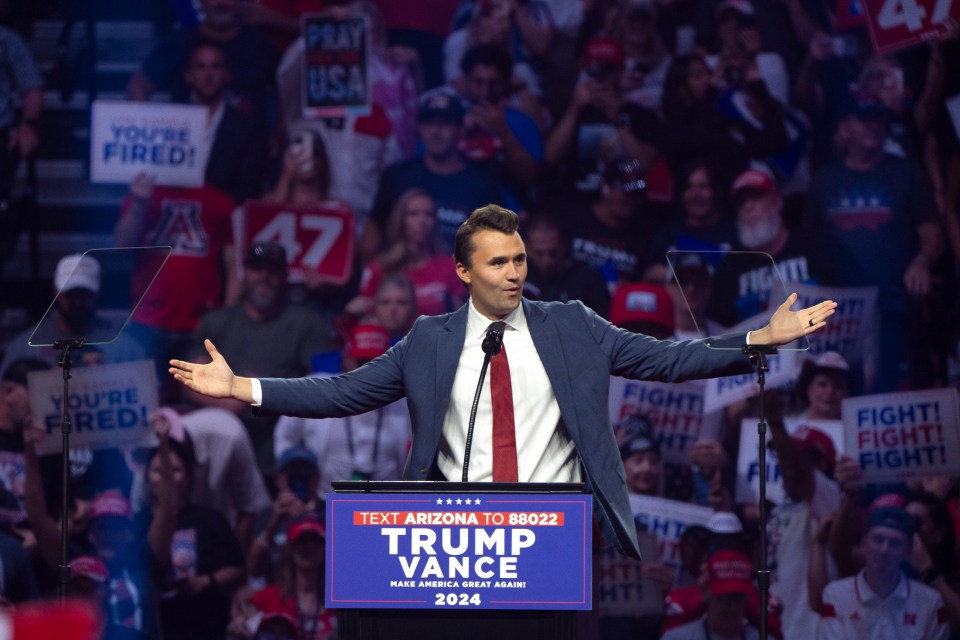 Charlie Kirk speaking at a campaign rally for Trump Vance 2024.