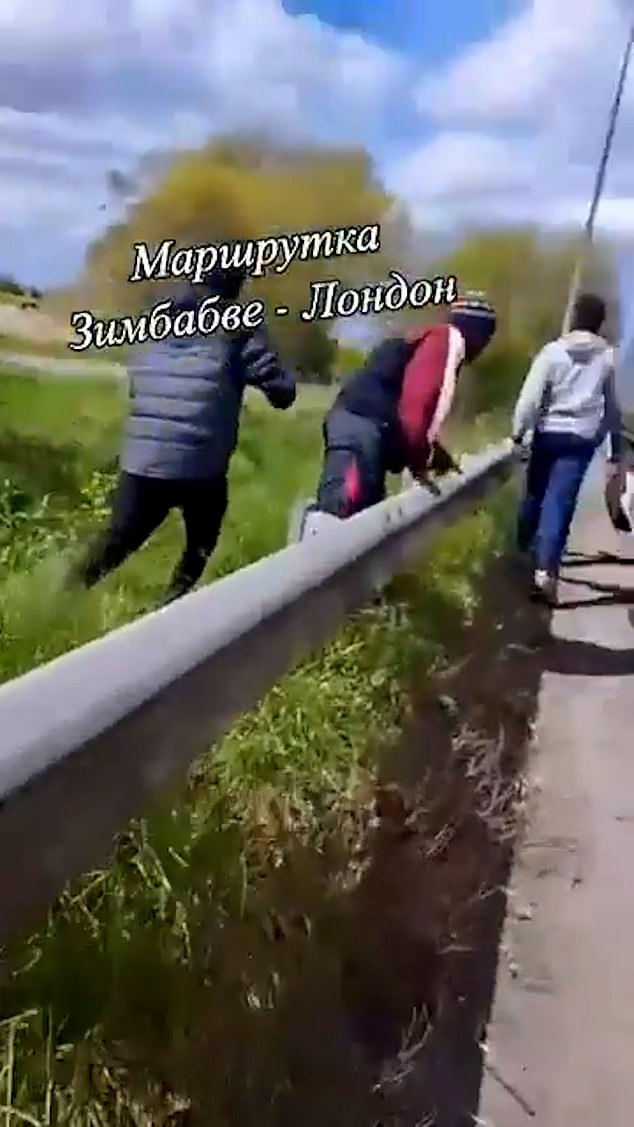 The driver can be heard shouting as the four young men disembark the lorry and scurry off into a nearby field