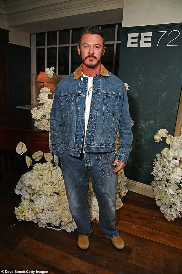 Luke Evans opted for a more casual look in a denim jacket with matching jeans and a white T-shirt