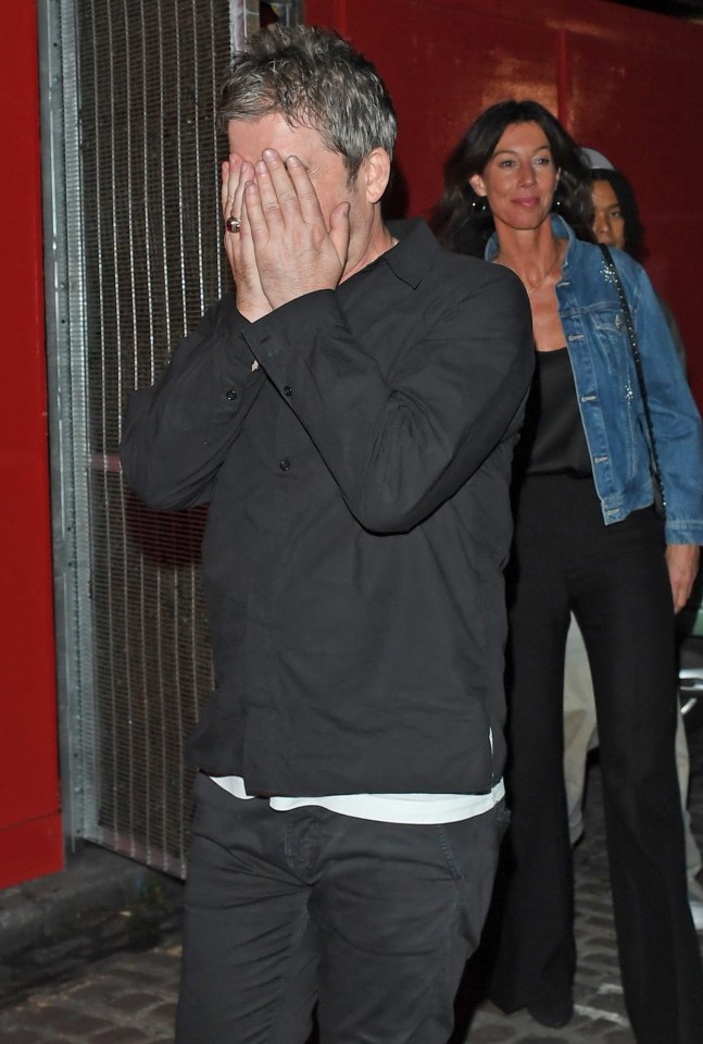 Noel Gallagher hiding his face as he leaves Chiltern Firehouse with Sally Field.