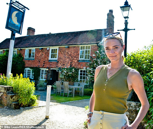 Model Jodie Kidd outside her pub in West Sussex, the Half Moon Inn