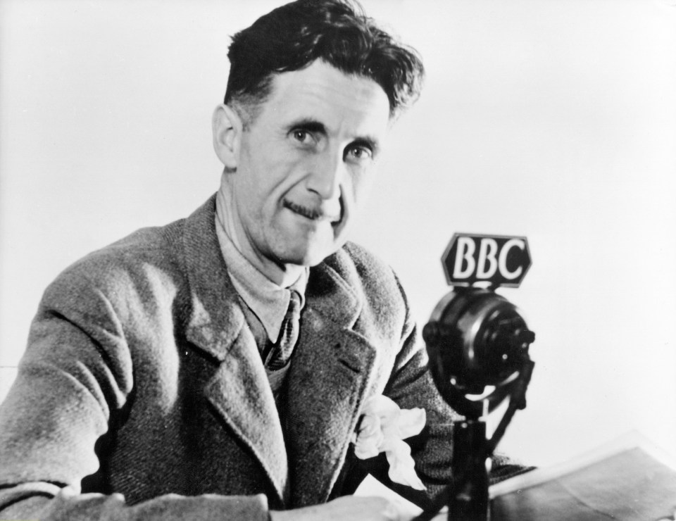 Portrait of George Orwell in front of a BBC microphone.