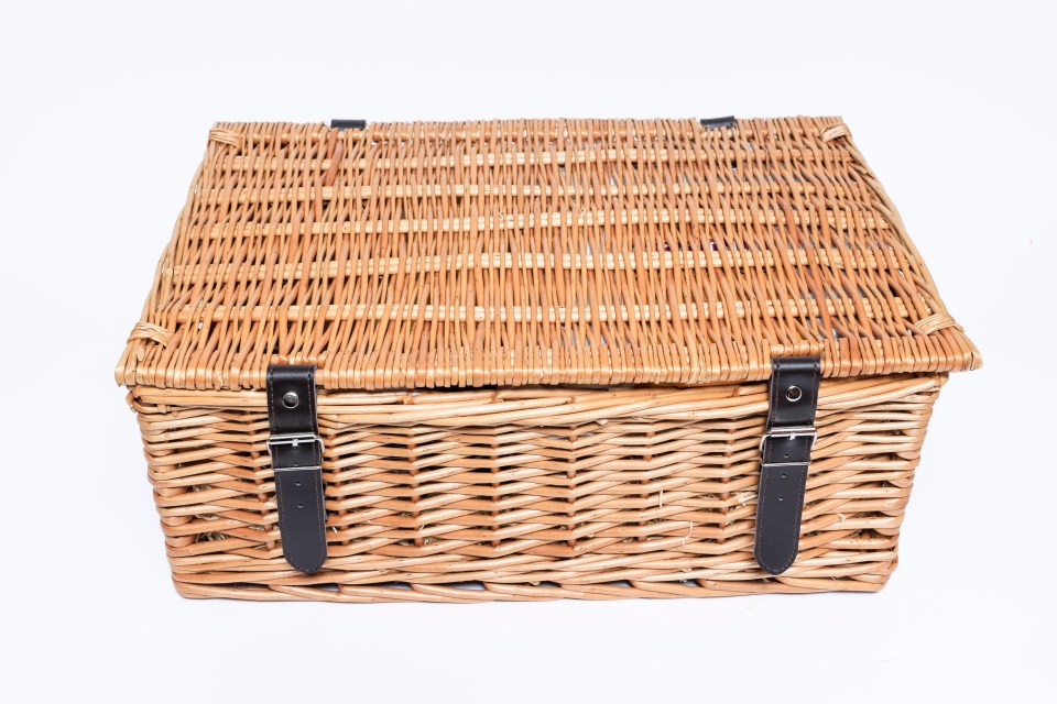 Able and Cole Festive Breakfast Hamper in a closed wicker basket.
