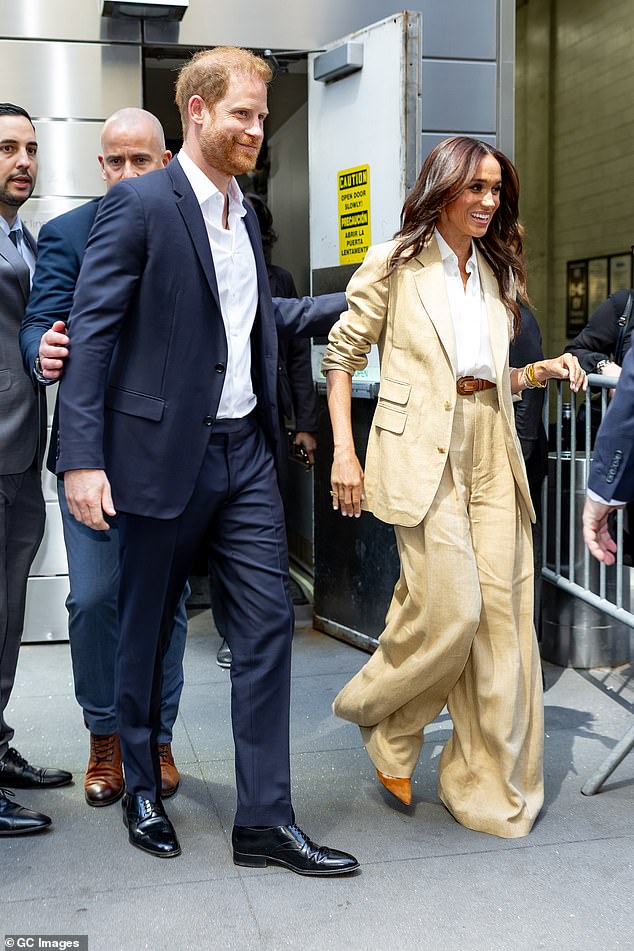 Judi said: 'At the Times 100 event, Meghan is no longer weakly attached to an alpha-posing husband as she was with Trevor