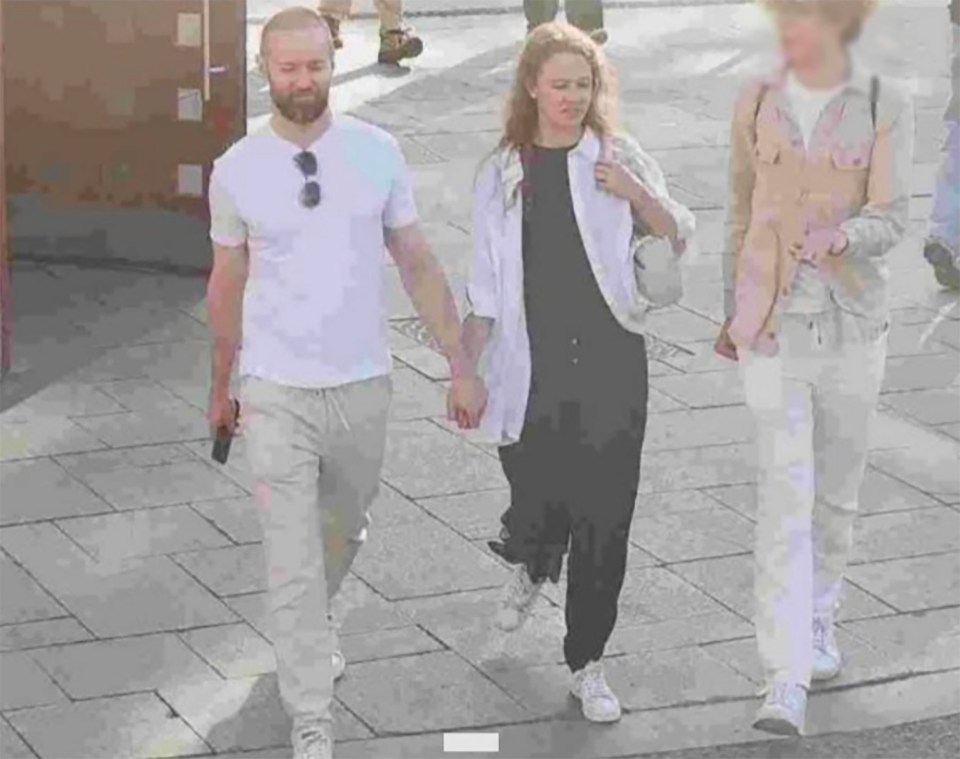Jan Marsalek and Tatiana Spiridonova holding hands in Moscow.