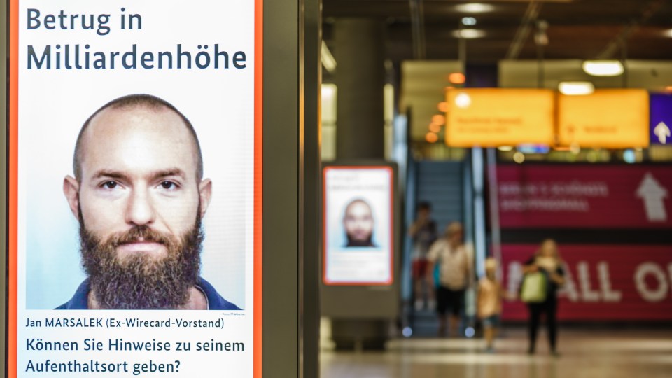 Wanted poster for Jan Marsalek, ex-Wirecard board member, for fraud, displayed at Potsdamer Platz station in Berlin.