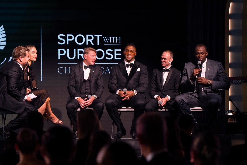Laura Woods, Anthony Joshua, Usain Bolt, and James Corden on stage at the Pho3nix Foundation Awards.