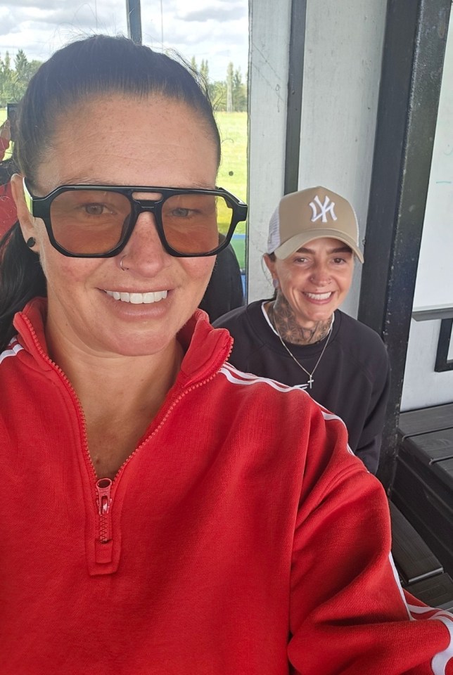 Two women smiling for a selfie.