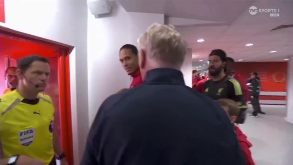 David Moyes arguing with a referee in the tunnel before a soccer match.